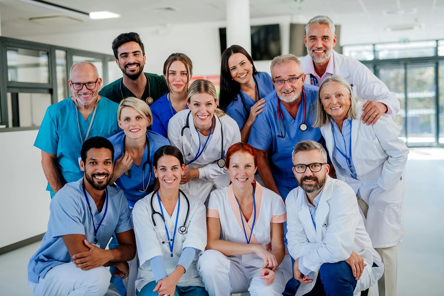 portrait of happy doctors, nurses, and other medical staff