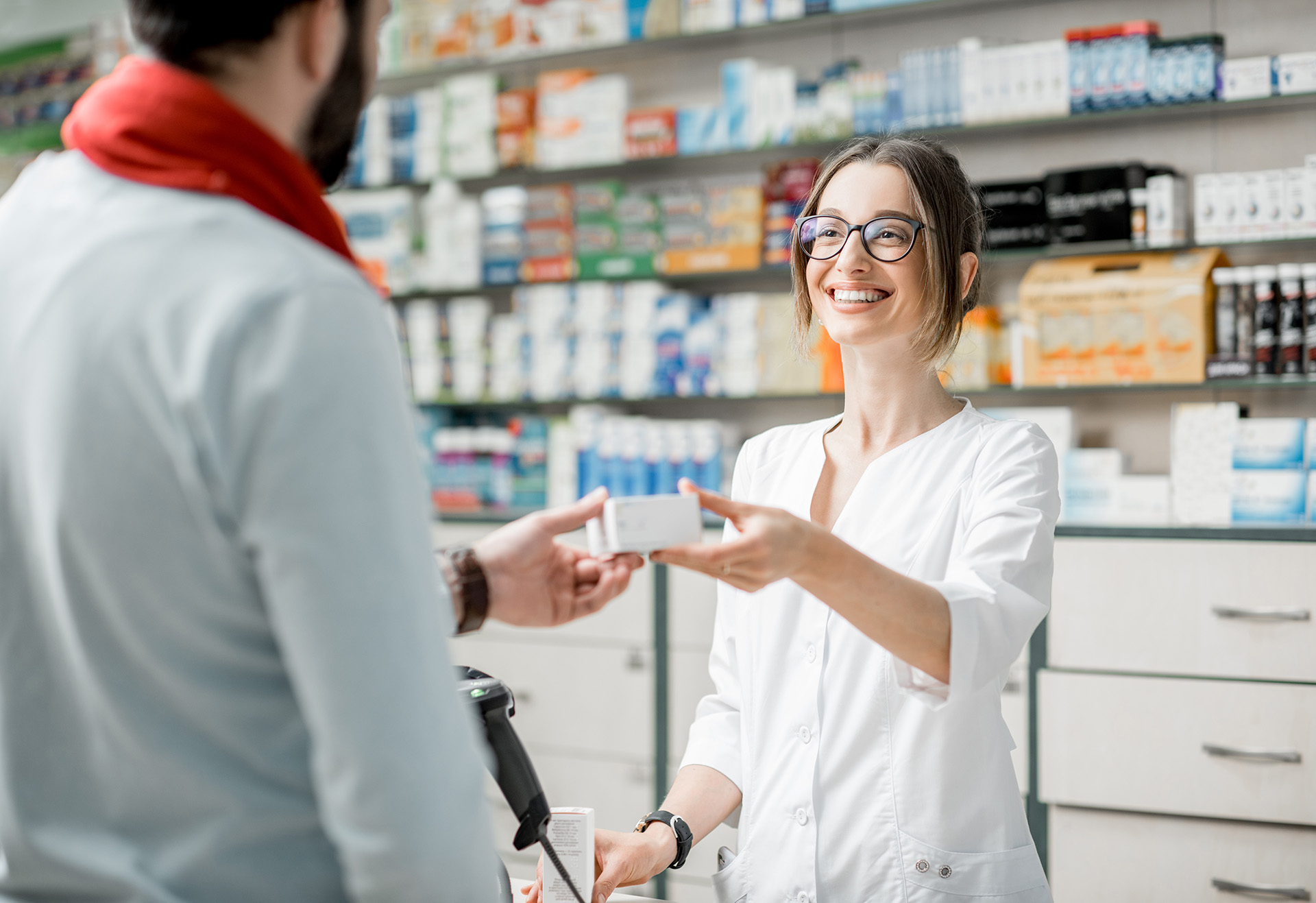 pharmacist selling medications in the-pharmacy